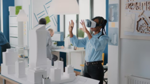 A girl creates a model of a building using a VR headset