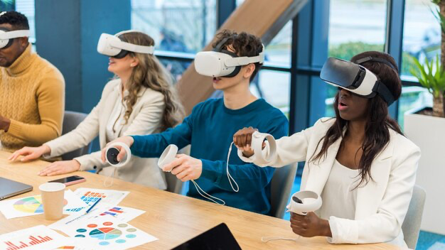 A group of people wearing VR glasses are playing at a table