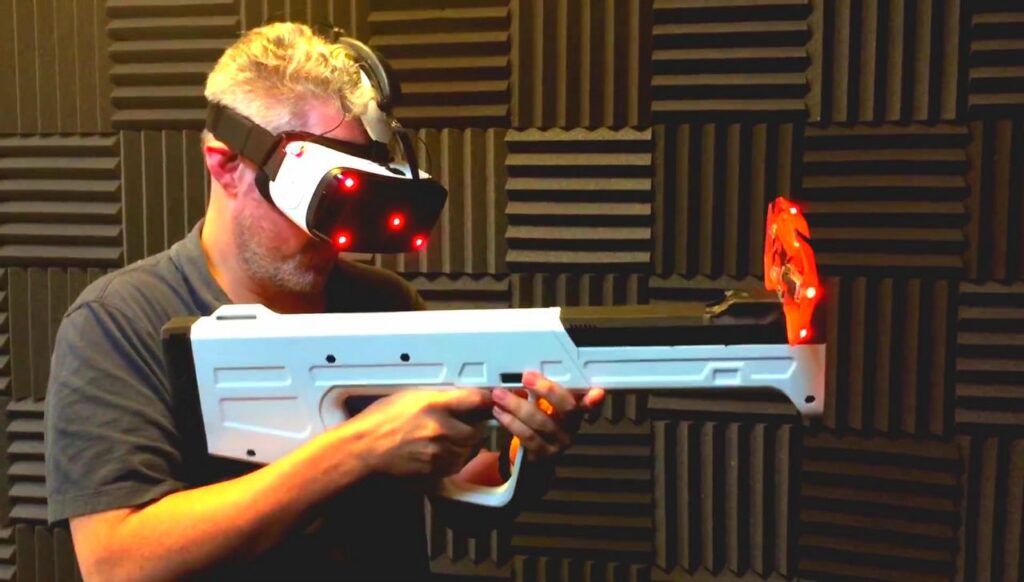 Man in vr glasses with a gun