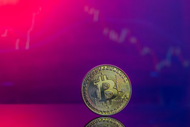 Close-up of a golden bitcoin on a pink and blue background