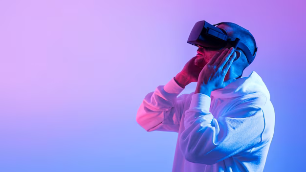 Man in VR headset on pink background